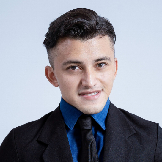 Professional headshot of Jhanier Cardoza, Client Relationship Manager at Stelmakh & Associates, wearing a black suit, blue shirt, and black tie, with a confident smile.